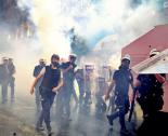Turkish riot police march through a cloud of tear gas (Jenna Pope | Occupy Gezi)