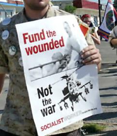 Protesters organized by Iraq Veterans Against War march outside Fort Hood in July (Madeleine Dubus)