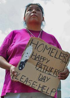 A Native American woman asks for donations near Minneapolis (Wen-Yan King)