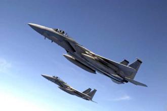 Two F-15 Eagle fighter jets perform a training exercise  (Miranda Moorer)
