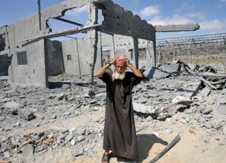 A Palestinian man reacts to the demolition of his home in Gaza (Mohammed Al Baba)