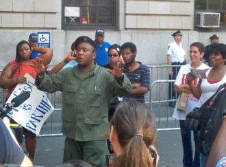 Supporters of anti-police brutality activist Jazz Hayden listen to a speaker outside the 32nd Precinct (Yoni Golijov | SW)