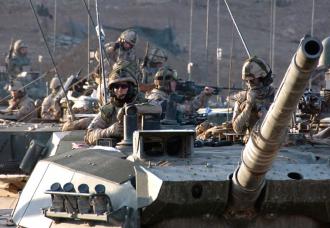 Tank crews in Afghanistan wait for the order to move out (Edward Stewart)