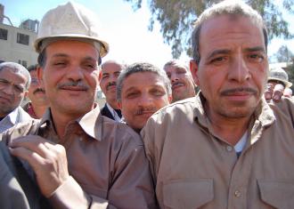 Workers at the Tora Cement factory celebrate after a successful sit-in over pay and conditions in 2009 (Sarah Carr)
