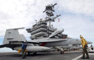 Pilots conduct test flights from the deck of the USS George Washington aircraft carrier off the coast of the Korean Peninsula (Lee Jung-Hoon)
