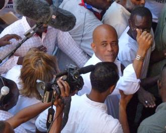 Haitian Presdent Michel Martelly surrounded by the media (Rozanna Fang)