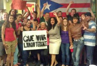 Residents of Lyman Terrace celebrate the mayor's retreat on demolishing their housing project (Que Viva Lyman Terrace)