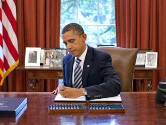 Barack Obama signs last summer's Budget Control Act (Pete Souza)