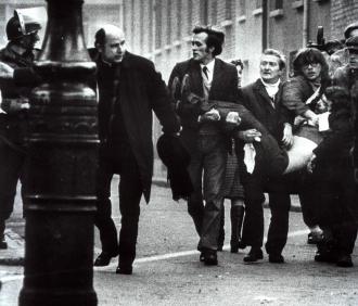 Protesters at the January 30, 1972 march carry the body of a victim of the Bloody Sunday shooting