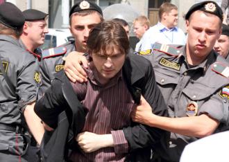 Russian police arrest an LGBT rights protester at a demonstration in May (Sergey Kukota)