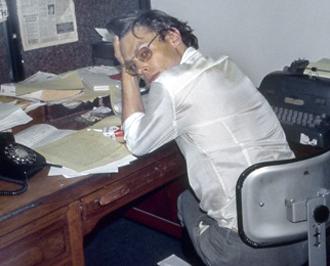 Alexander Cockburn at the Village Voice in the late 1970s (Sylvia Plachy)