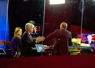 From left: Savannah Guthrie and David Gregory on the NBC News set with Brian Williams (Phil Davis)