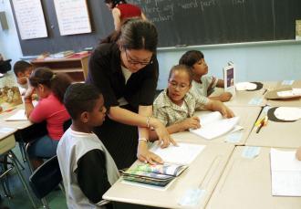 A teacher works with students at a school in Harlem (Richard B. Levine | Showcase)