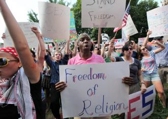 Some 500 people gathered for a hastily organized counter-protest against the attack on Muslims (Bill Steber | SteberPhoto.com)