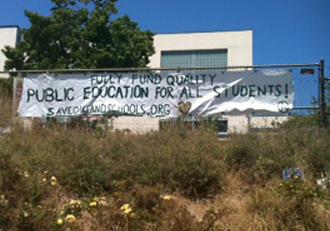 A banner hangs outside the sit-in at Lakeview Elementary in Oakland (Jessie Muldoon | SW)