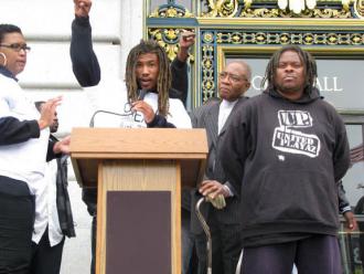 Fly Benzo speaking at a protest outside San Francisco's City Hall (Indybay.org)