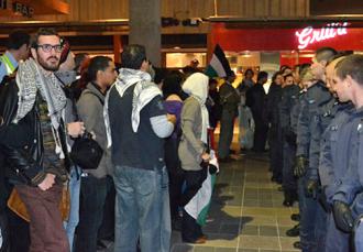 Palestine solidarity activists face off against police at a demonstration in Melbourne