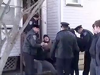 A demonstrator protesting the eviction of Catherine Lennon and her family is arrested