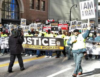 DeKalb County sanitation workers march down Peachtree Street in downtown Atlanta (Ben Smith | SW)