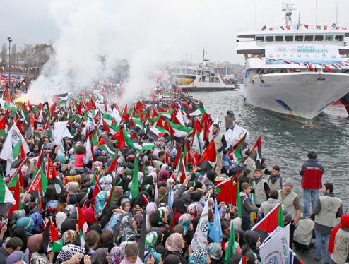 Supporters cheer as the Mavi Marmara returns from the first Gaza Freedom Flotilla