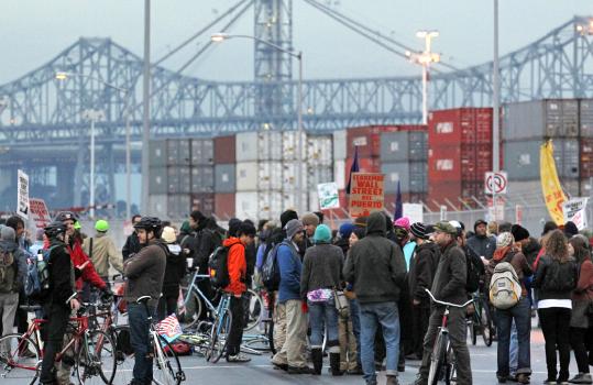 Protesters gathered in front of the gates to the Port of Oakland