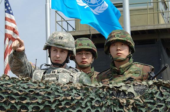 U.S. and South Korean soldiers survey the demilitarized zone from an observation post