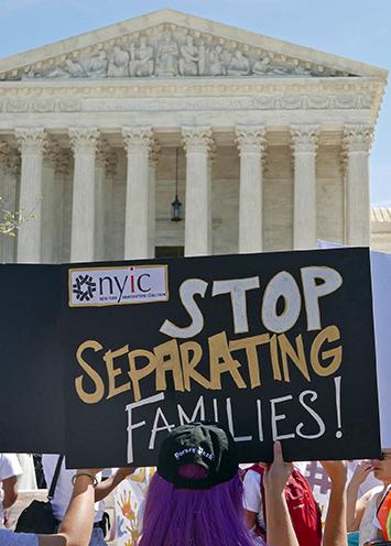 Immigrant rights activists gather in front of the U.S. Supreme Court