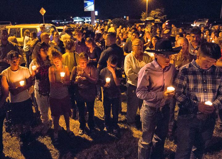Residents of Sutherland Springs, Texas, hold a candlelight vigil