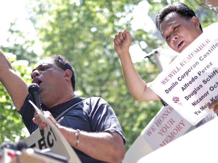New York Taxi Workers' Alliance organizer Biju Mathew (left), with Kenny Chow's brother, Richard Chow, at a press conference outside City Hall