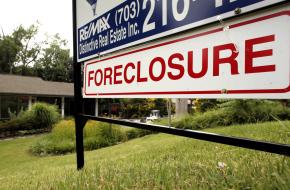 A foreclosure sign in front of a house in Falls Church, Va.