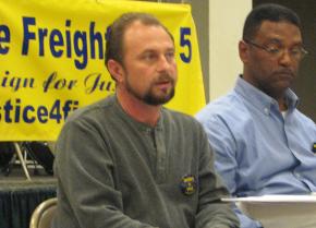 Freightliner Five member Allen Bradley (left) speaks at a New York City solidarity meeting; next to him is Robert Whiteside