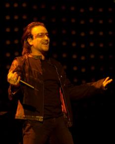 Bono performing with U2 in Boston