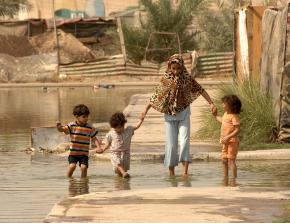 A displaced family living in a flooded section of Baghdad