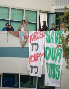 Vestas workers are cheered by supporters below