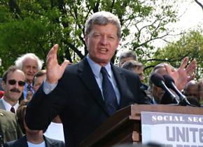 Max Baucus speaks at a rally held outside the Capitol building