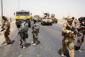 British troops, along with U.S. and Iraqi soldiers, maintain a checkpoint outside Basra
