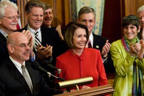 Democratic leaders celebrate the passage of a health care bill in the House of Representatives