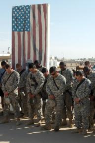 Soldiers observe a moment of silence following the shooting at Fort Hood