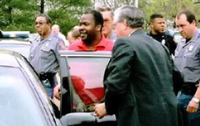 Curtis Flowers being escorted by police