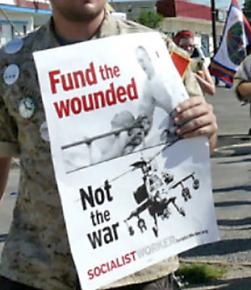 Protesters organized by Iraq Veterans Against War march outside Fort Hood in July