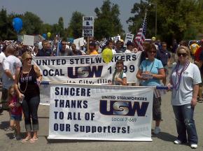 Members and supporters of the United Steel Workers rally in support of locked-out workers in Metropolis, Ill.