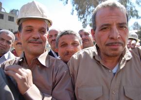 Workers at the Tora Cement factory celebrate after a successful sit-in over pay and conditions in 2009