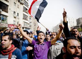 Protesters wind through the Nasr City neighborhood of Cairo