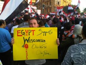 An Egyptian demonstrator shows his solidarity with workers protesting in Wisconsin
