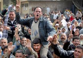 Workers at a factory in Suez strike following the successful revolt against Mubarak