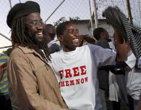 Munyaradzi Gwisai and fellow activists celebrate as they are released from prison