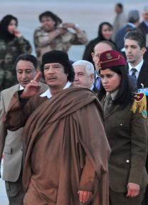 Col. Muammar el-Qaddafi walks with his bodyguards
