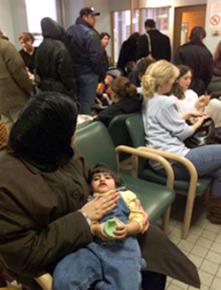 Patients in a public hospital wait for care