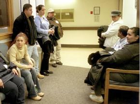 Patients wait for care at a public hospital