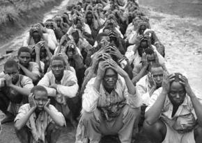 Kenyan men rounded up and detained on charges of being involved in the Mau Mau anticolonial movement
